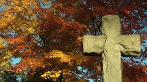 cross with fall leaves